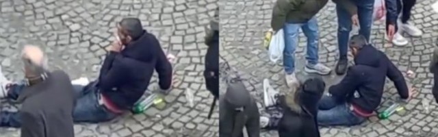 (VIDEO) ČOVEK LEŽI KRVAV KOD ZELENOG VENCA! Ljudi se okupili da mu pomognu!